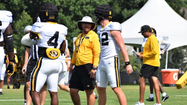 Missouri head coach Eli Drinkwitz talks with quarterback Brady Cook (12) during a preseason practice on August 7, 2022.